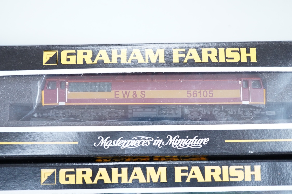 Three boxed Graham Farish N gauge railway diesel locomotives; an EWS class 56, 56105 (371300), a Load Haul class 56, Kellingley Colliery 56 074 (371301), and a Freightliner class 57, Freightliner Challenger 57011, (37122